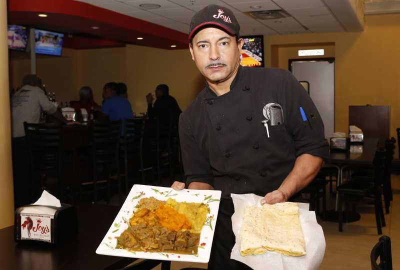 Joy's Roti Delight Joys Roti-Chef Mike - Island Origins Magazine Spring 2018